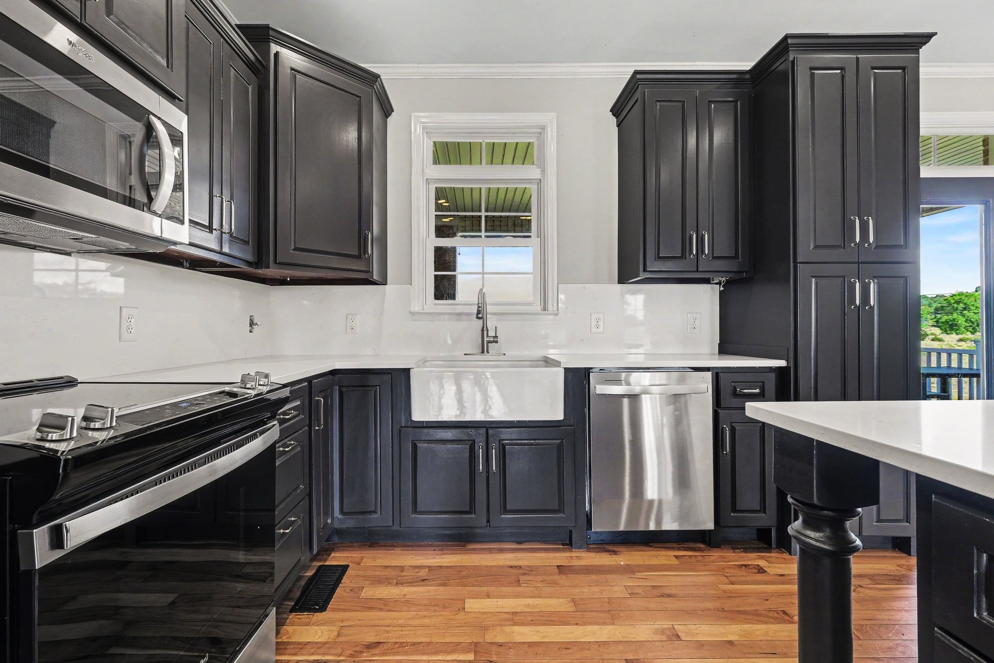 2829 Anes Station Road Lewisburg, TN 37091 - Photo 14 of 43 a kitchen with stainless steel appliances wooden cabinets and a stove top oven