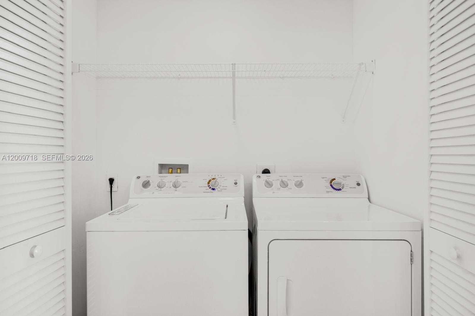 2602 East Hallandale Beach Boulevard, Unit R803 Hallandale Beach, FL 33009 - Photo 6 of 9 a utility room with dryer and washer