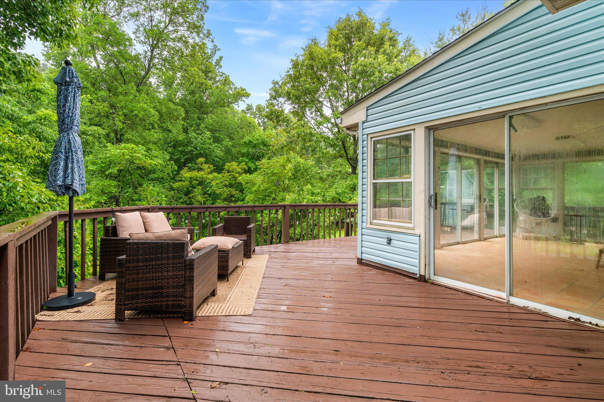 4217 Bill Moxley Road Mount Airy, MD 21771 - Photo 43 of 57 a view of a deck with two chair and wooden floor