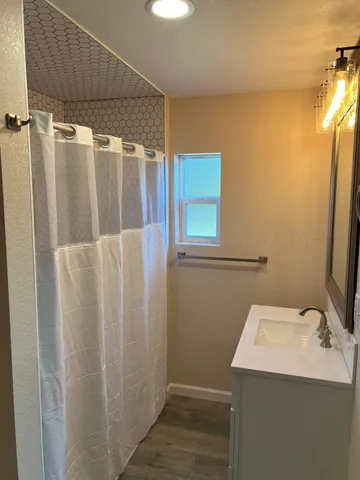 a bathroom with a sink and a mirror