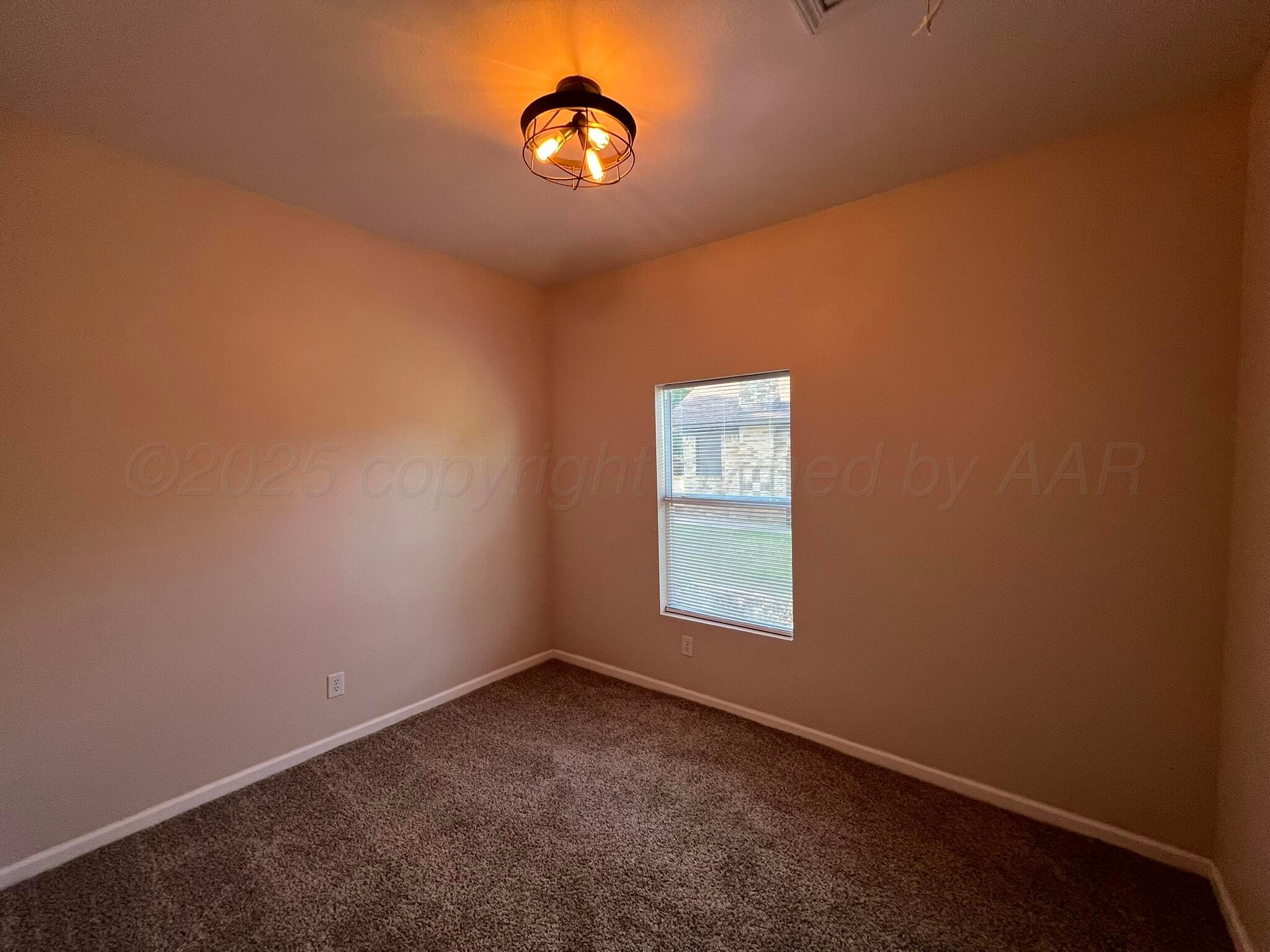 817 South 6th Street Memphis, TX 79245 - Photo 26 of 43 an empty room with a window
