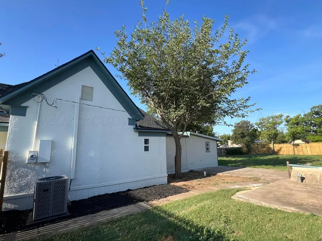 a view of a swimming pool with an outdoor space and seating area