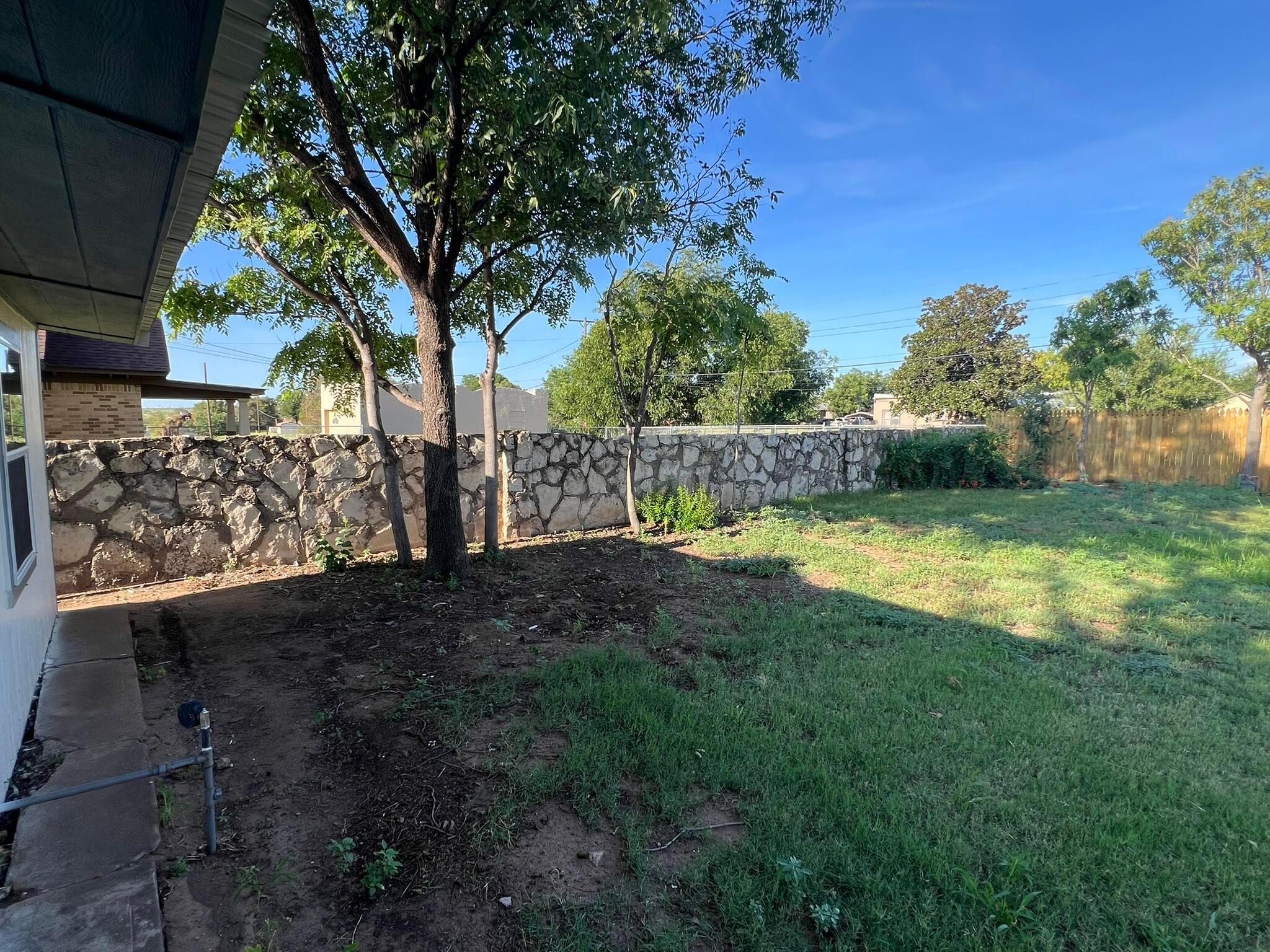 817 South 6th Street Memphis, TX 79245 - Photo 37 of 43 a view of a yard with large trees
