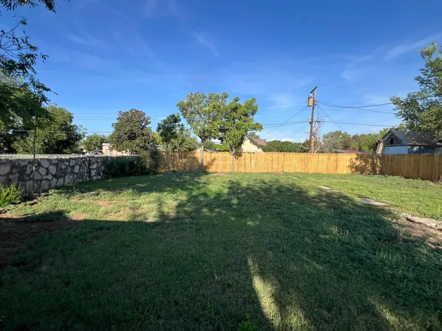 a view of a backyard with a small pool