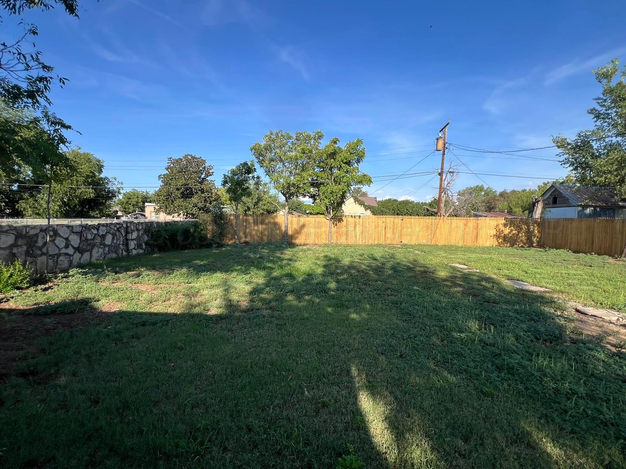 817 South 6th Street Memphis, TX 79245 - Photo 38 of 43 a view of a swimming pool with an outdoor space and seating area