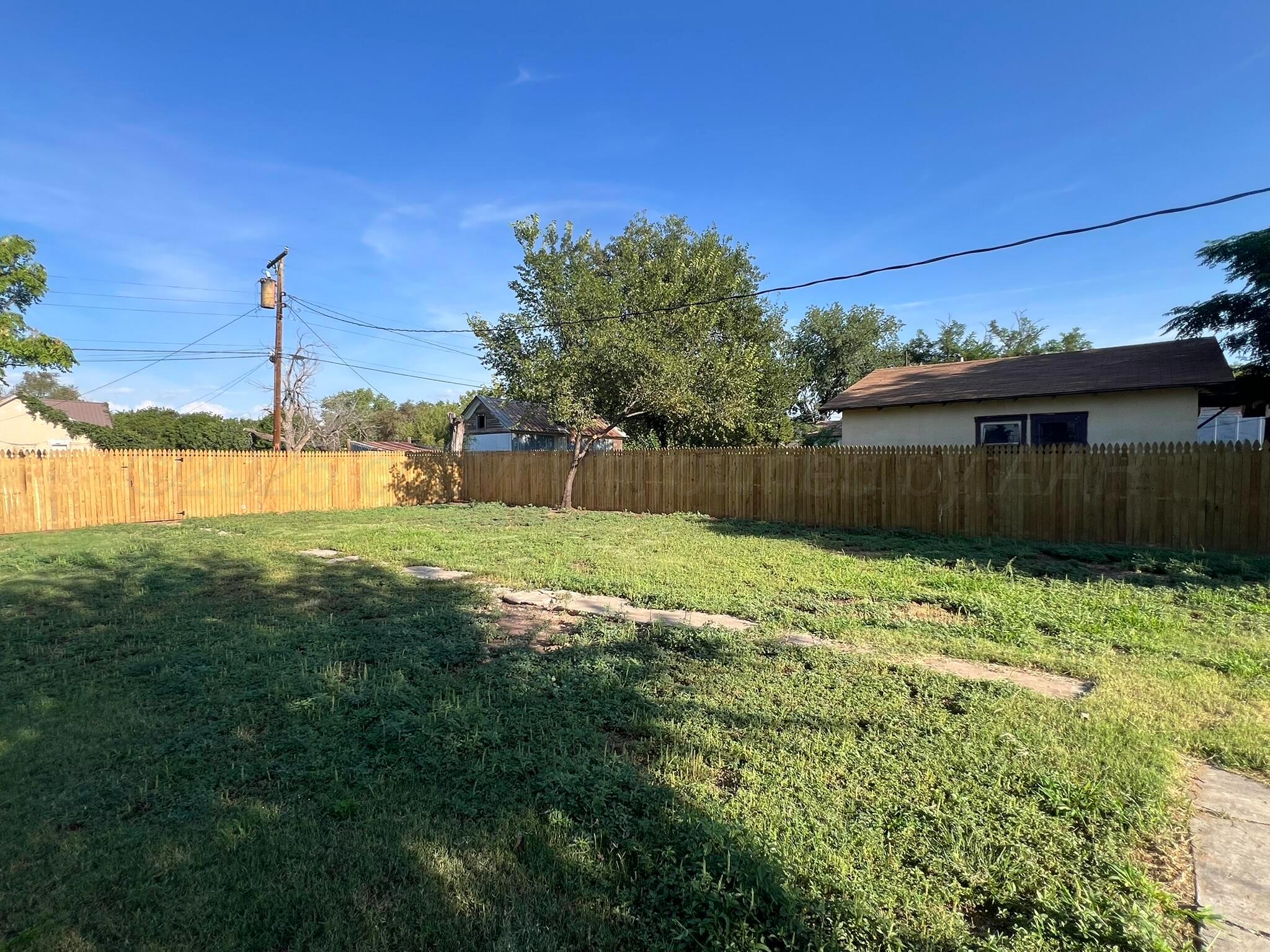 817 South 6th Street Memphis, TX 79245 - Photo 39 of 43 a view of a backyard with a garden