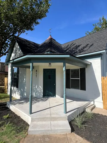 a view of a house with a iron gate