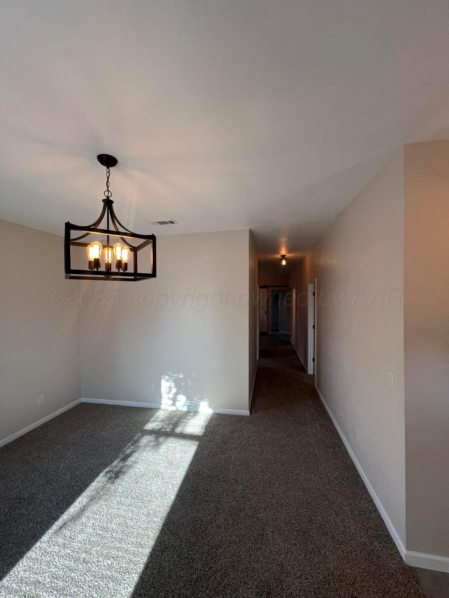817 South 6th Street Memphis, TX 79245 - Photo 10 of 43 a very nice looking room with a ceiling fan
