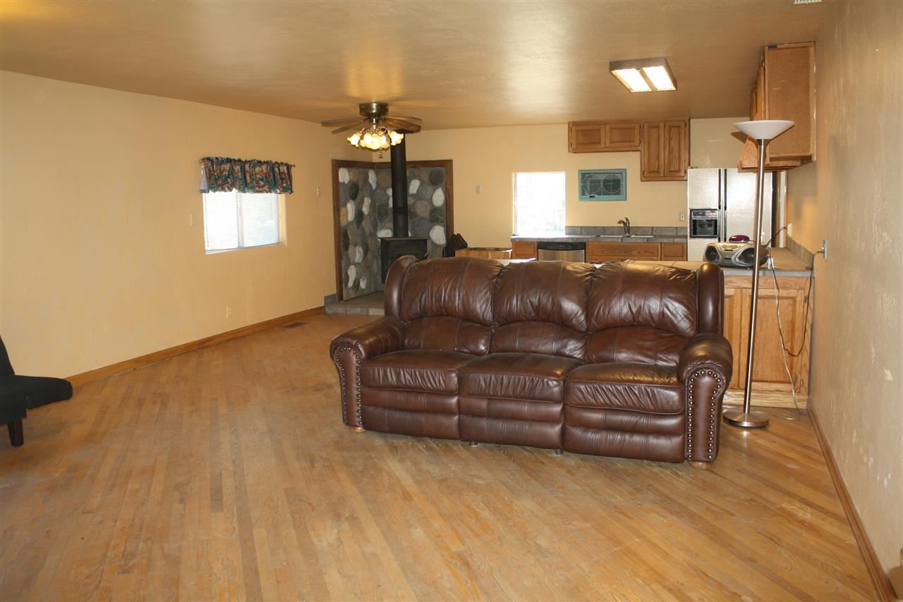 5298 Show Low Lake Road Lakeside, AZ 85929 - Photo 14 of 36 a living room with furniture and a chandelier