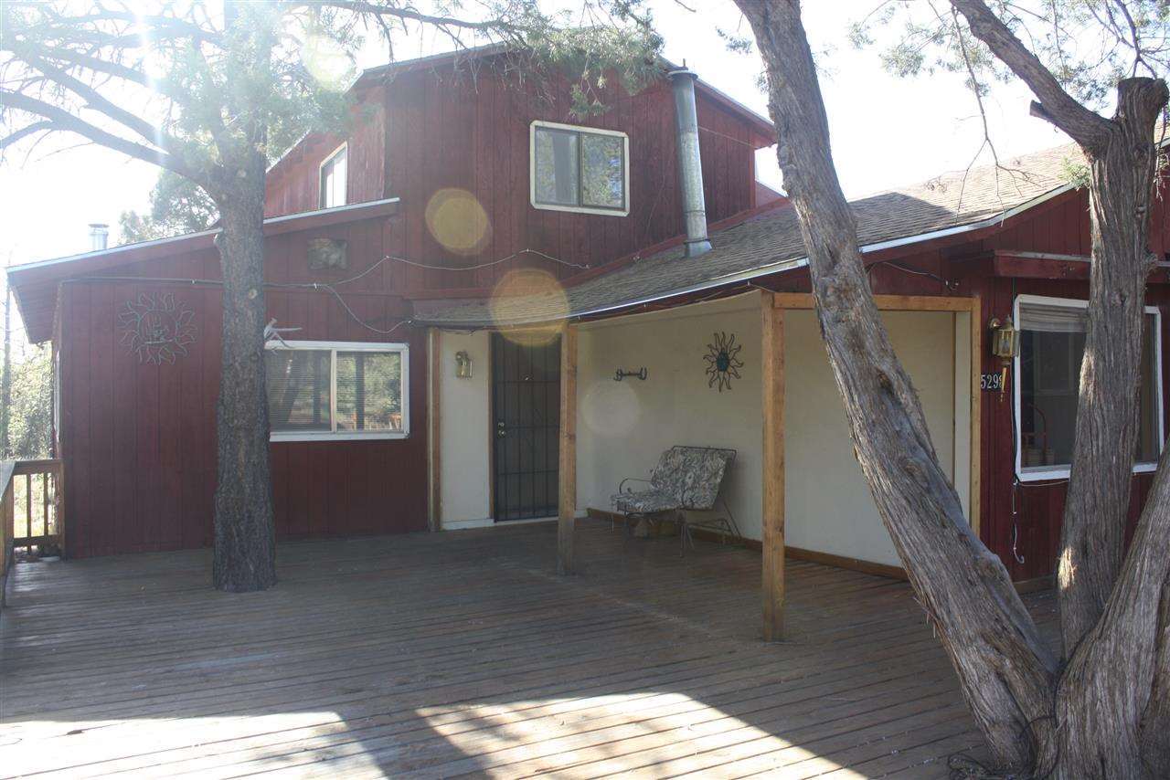5298 Show Low Lake Road Lakeside, AZ 85929 - Photo 2 of 36 a view of a building with a large tree