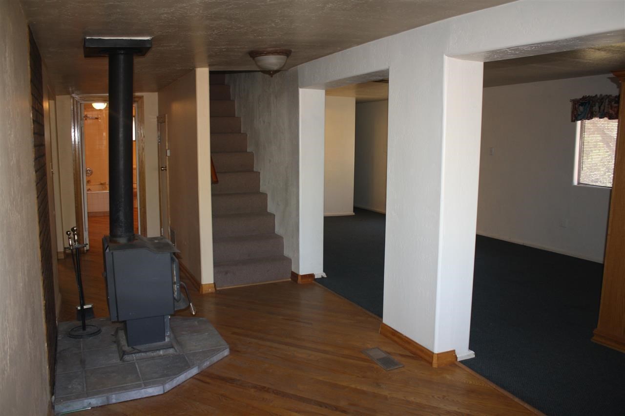 5298 Show Low Lake Road Lakeside, AZ 85929 - Photo 30 of 36 a view of a hallway with wooden floor and staircase