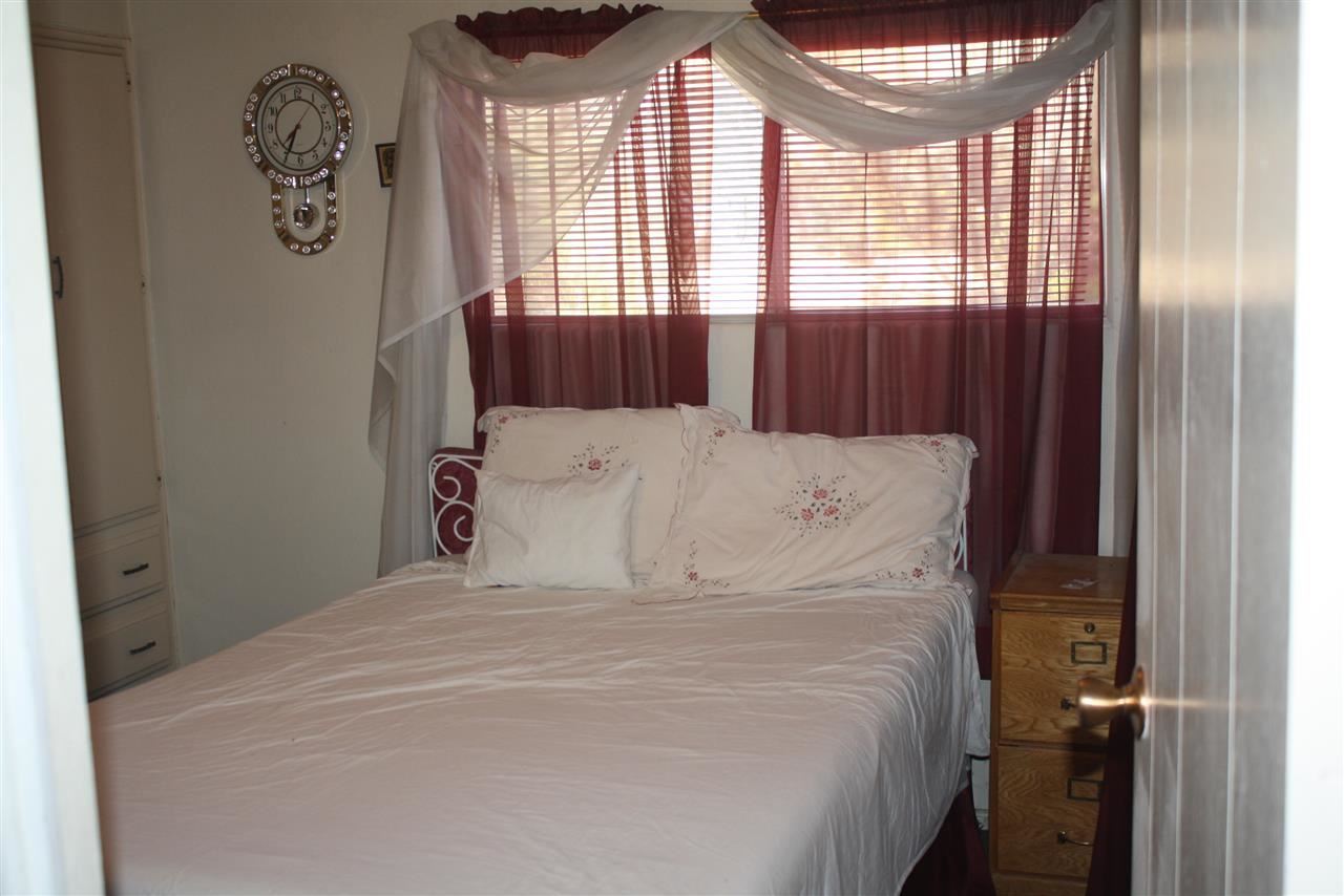 5298 Show Low Lake Road Lakeside, AZ 85929 - Photo 31 of 36 a large bed sitting in a bedroom next to a window