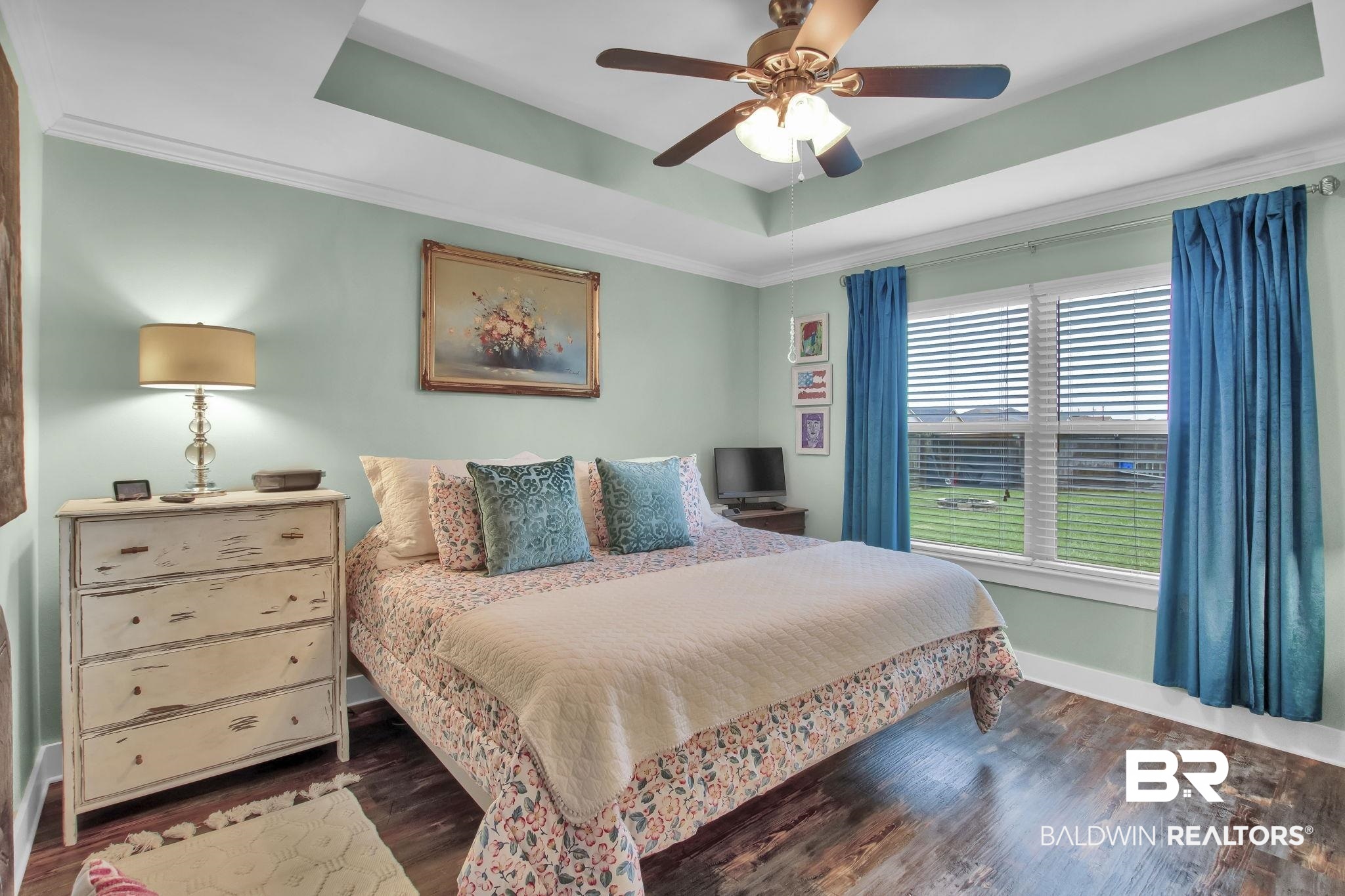 203 Lakefront Circle Summerdale, AL 36580 - Photo 33 of 69 Bedroom featuring a raised ceiling, ornamental molding, hardwood / wood-style floors, and ceiling fan