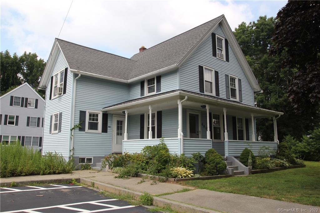 480 Pleasant Valley Road South, Unit 480 Groton, CT 06340 - Photo 1 of 1 a front view of a house with a yard and trees