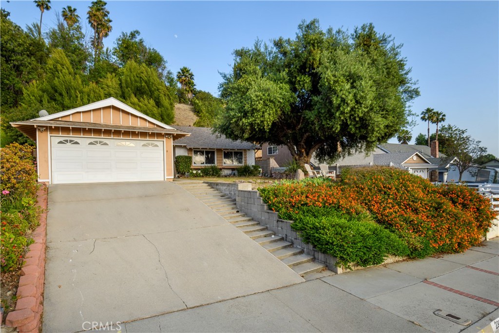 23646 Sunset Crossing Road Diamond Bar, CA 91765 - Photo 1 of 1 a front view of a house with garden