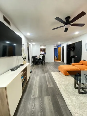 a large kitchen with stainless steel appliances kitchen island a large island in the center