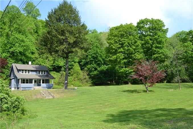763 Danbury Road Wilton, CT 06897 - Photo 1 of 1 a front view of a house with a yard