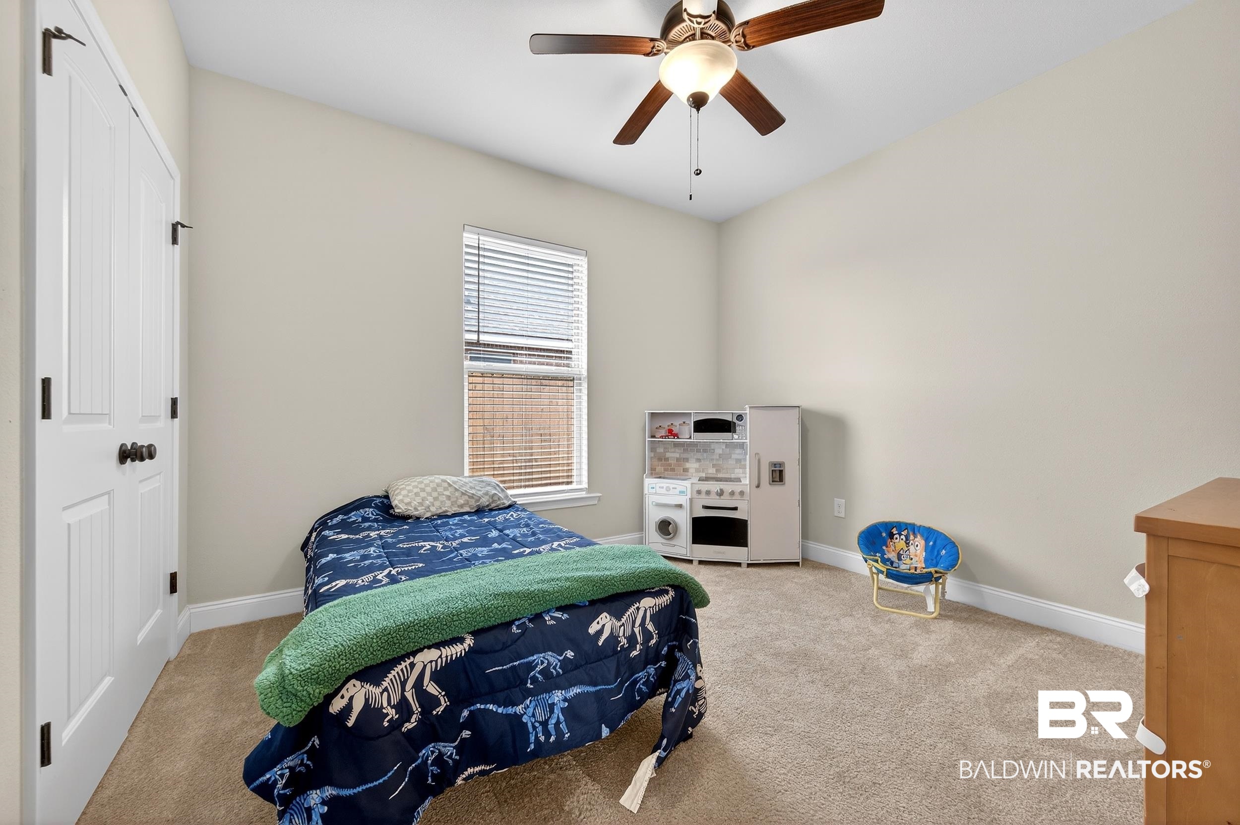 1084 Stella Road Foley, AL 36535 - Photo 24 of 31 Bedroom featuring a closet, light carpet, and a ceiling fan