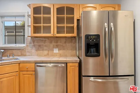 a white refrigerator freezer sitting in a kitchen