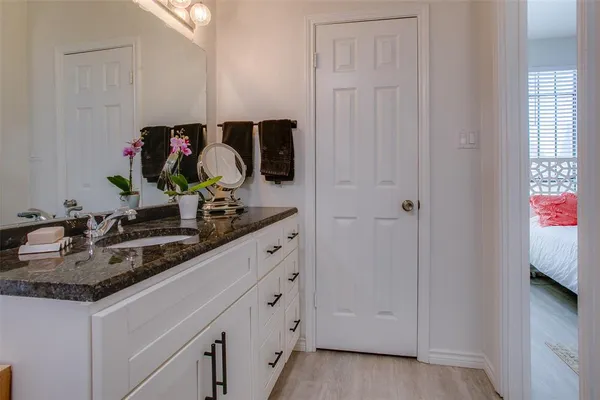 a bathroom with sink and mirror