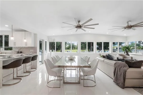 a view of a dining room with furniture window and outside view