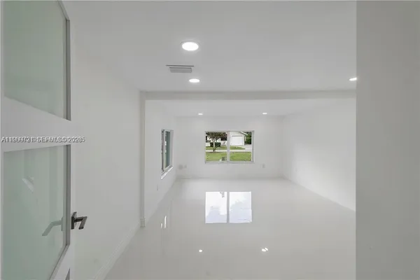 a view of a hallway with a window