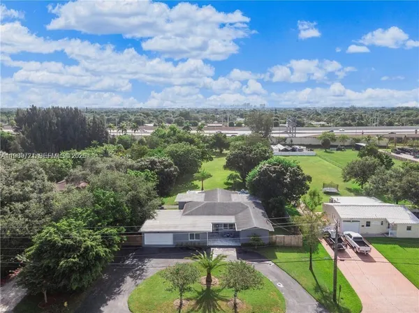 an aerial view of a house with a garden