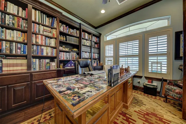 a living room with furniture a ceiling fan and a rug