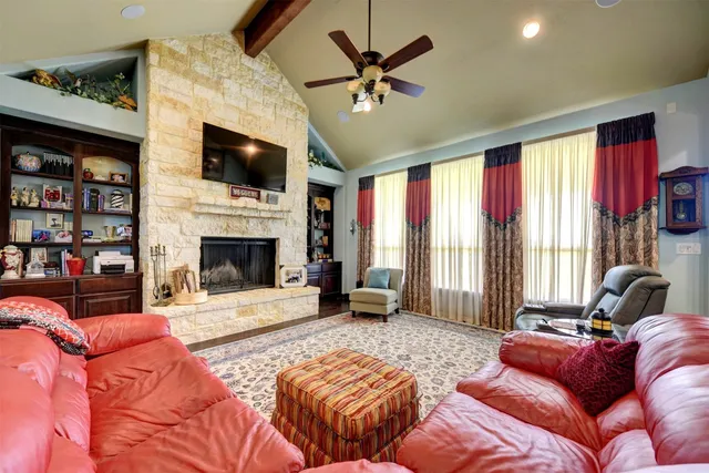 a large kitchen with stainless steel appliances granite countertop a large center island and a wooden floors
