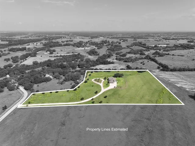a front view of a house with swimming pool having outdoor seating