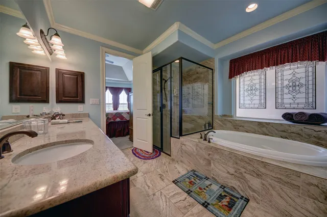 a bed room with a bed and a chandelier