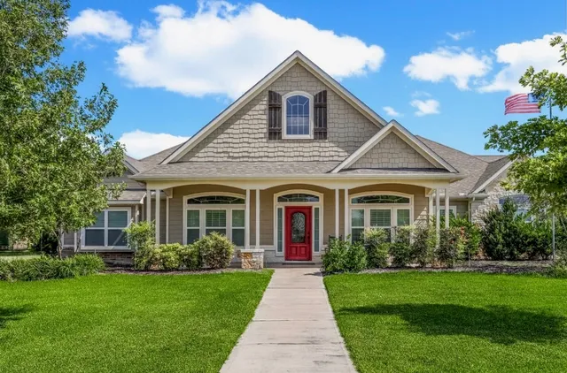 a living room with furniture fireplace and flat screen tv