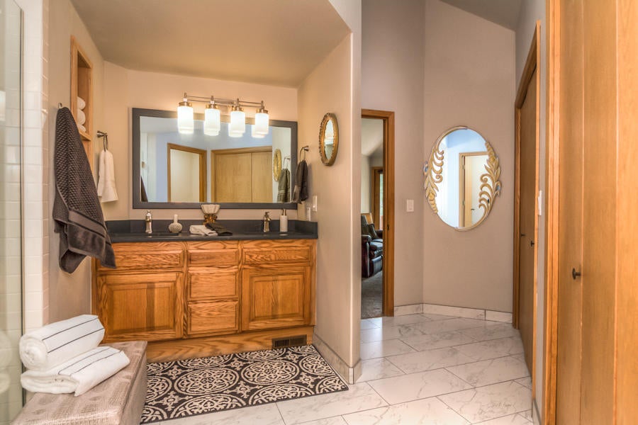 17691 Bittern Lane Sunriver, OR 97707 - Photo 13 of 18 The master bath has tile floors and entire wall of closets.