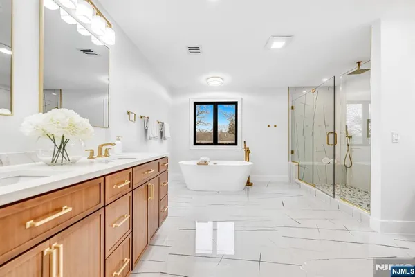 a bathroom with a bathtub and a shower