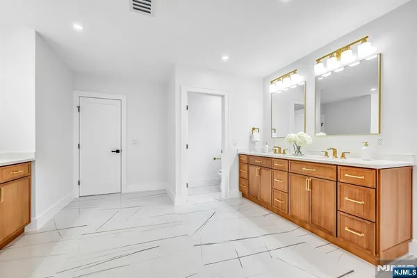 a bathroom with a bathtub and a sink
