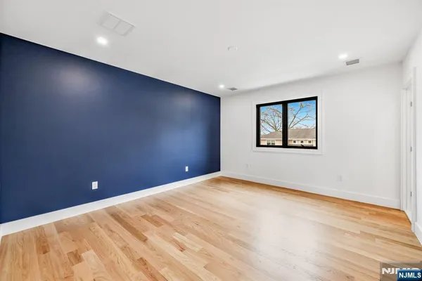 a bathroom with a shower sink and mirror