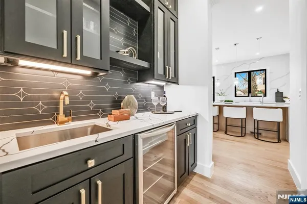 a kitchen with stainless steel appliances granite countertop a sink and cabinets