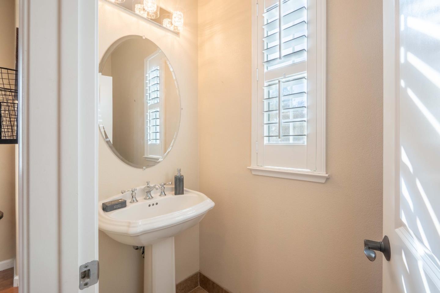 7180 Eagle Ridge Drive Gilroy, CA 95020 - Photo 47 of 63 a bathroom with a sink and a mirror