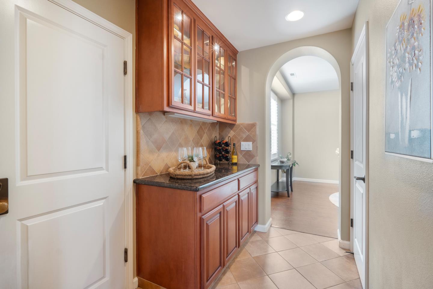 7180 Eagle Ridge Drive Gilroy, CA 95020 - Photo 9 of 63 a kitchen with stainless steel appliances granite countertop a stove and a refrigerator