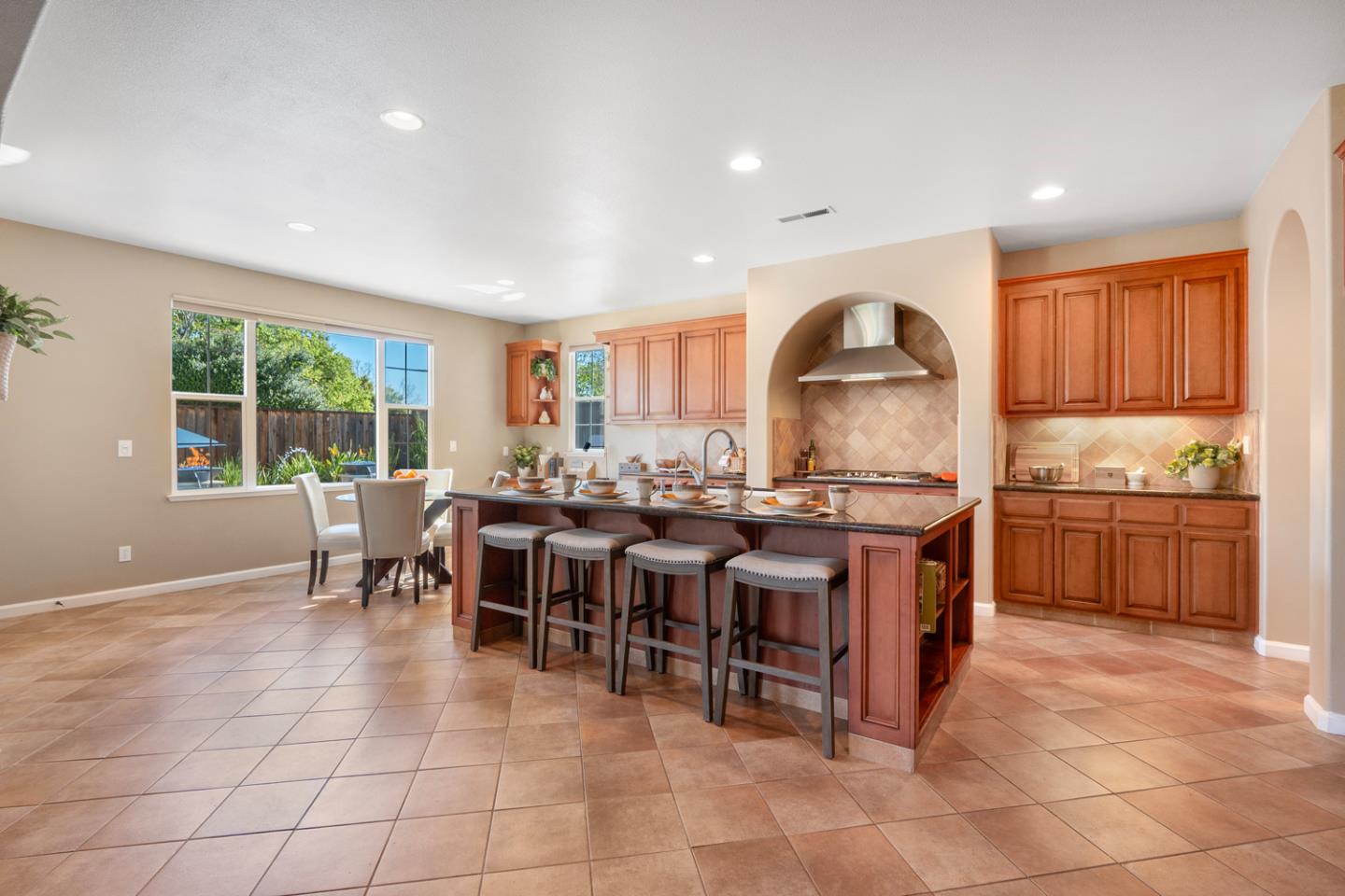 7180 Eagle Ridge Drive Gilroy, CA 95020 - Photo 10 of 63 a large kitchen with lots of counter top of dining table and chairs