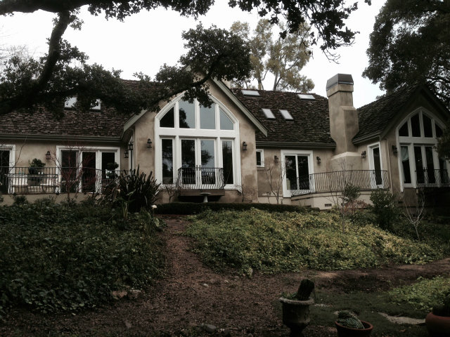 130 Alturas Drive Burlingame, CA 94010 - Photo 3 of 12 a front view of a house with a garden