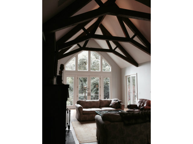 130 Alturas Drive Burlingame, CA 94010 - Photo 4 of 12 a living room with furniture and a large window