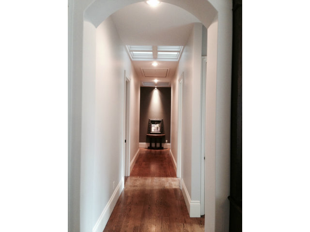 130 Alturas Drive Burlingame, CA 94010 - Photo 9 of 12 a view of a hallway with wooden floor and a large window