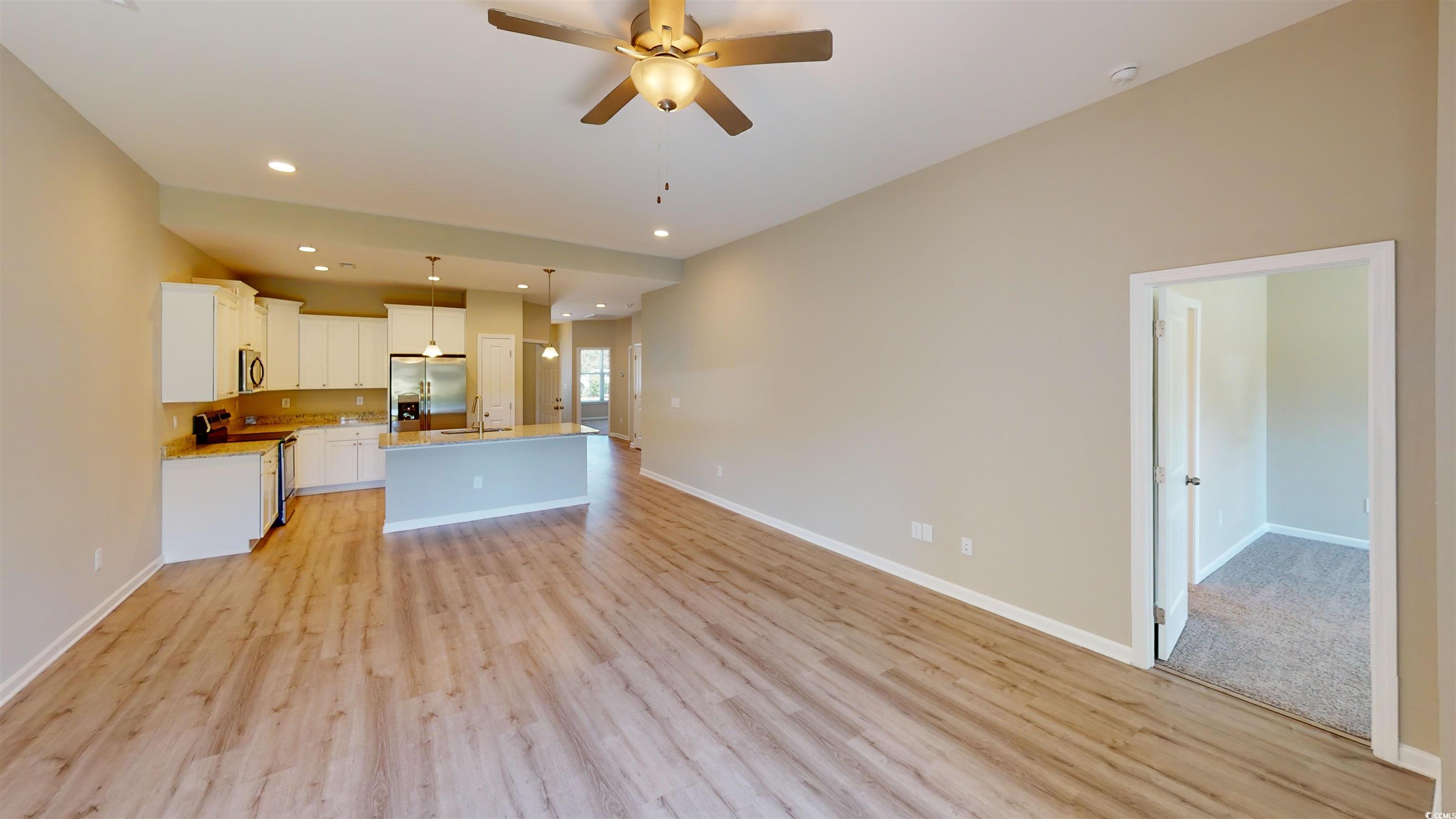 84 Racquet Club Drive, Unit WVC 14 Pawleys Island, SC 29585 - Photo 26 of 26 Kitchen with open floor plan, appliances with stainless steel finishes, white cabinetry, recessed lighting, and a center island