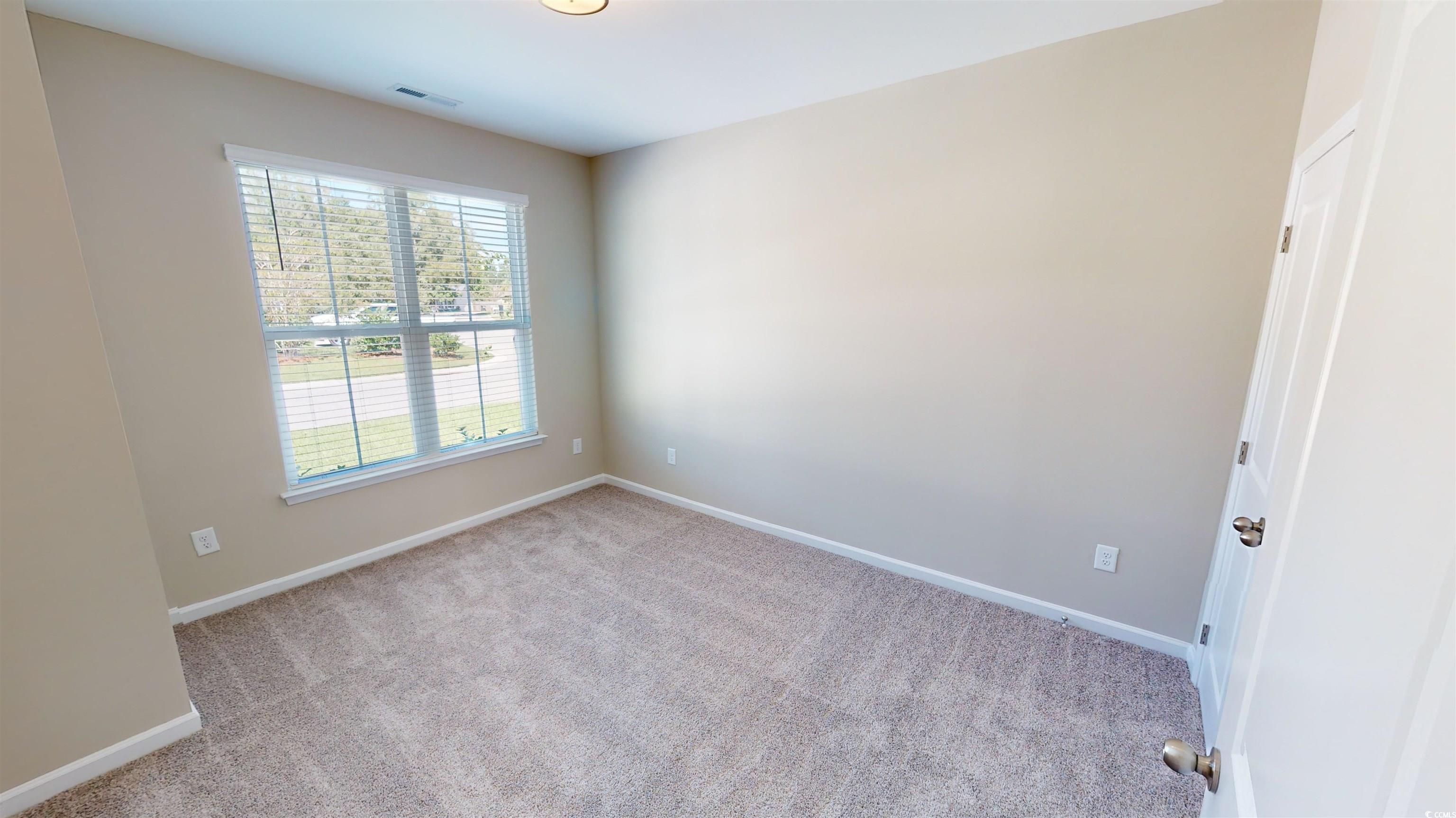 84 Racquet Club Drive, Unit WVC 14 Pawleys Island, SC 29585 - Photo 3 of 26 Empty room with carpet flooring and baseboards