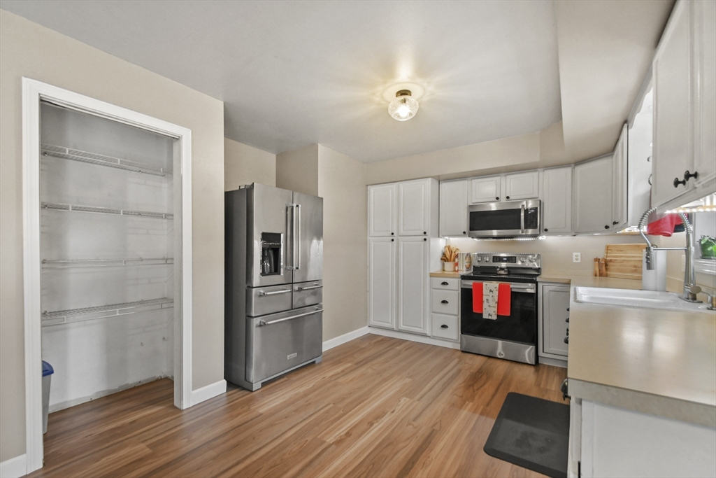 29 Prescott Street Rutland, MA 01543 - Photo 11 of 30 a kitchen with stainless steel appliances a stove refrigerator and microwave