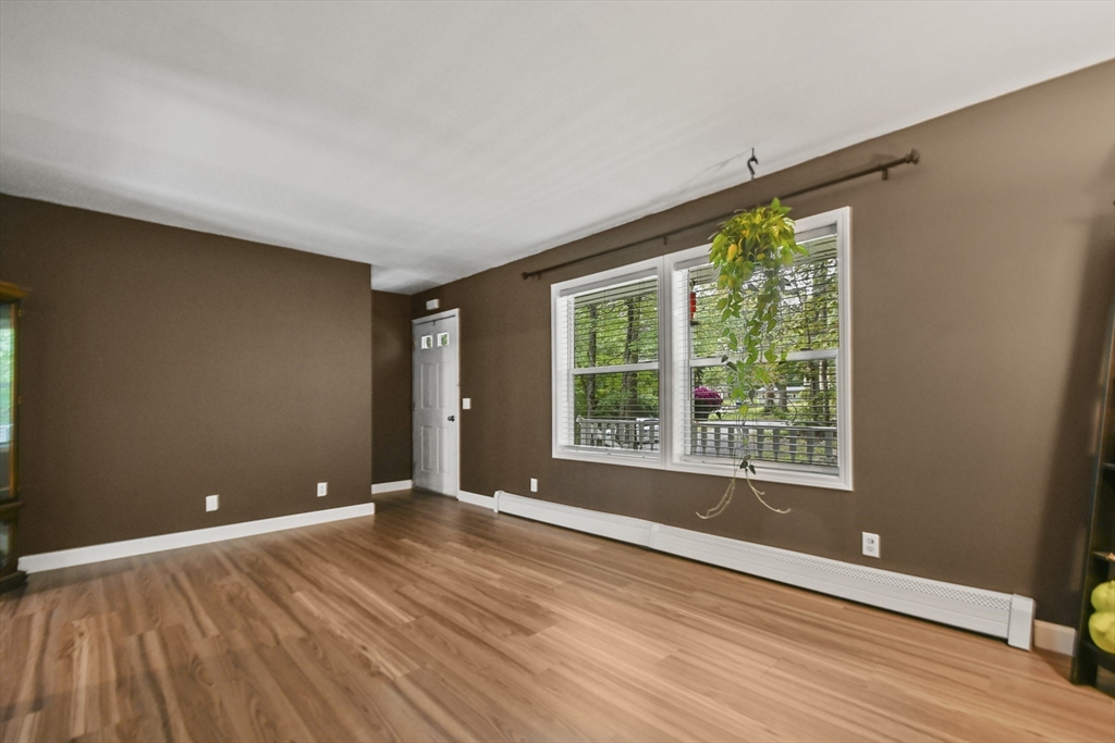 29 Prescott Street Rutland, MA 01543 - Photo 14 of 30 a view of an empty room with wooden floor and a window