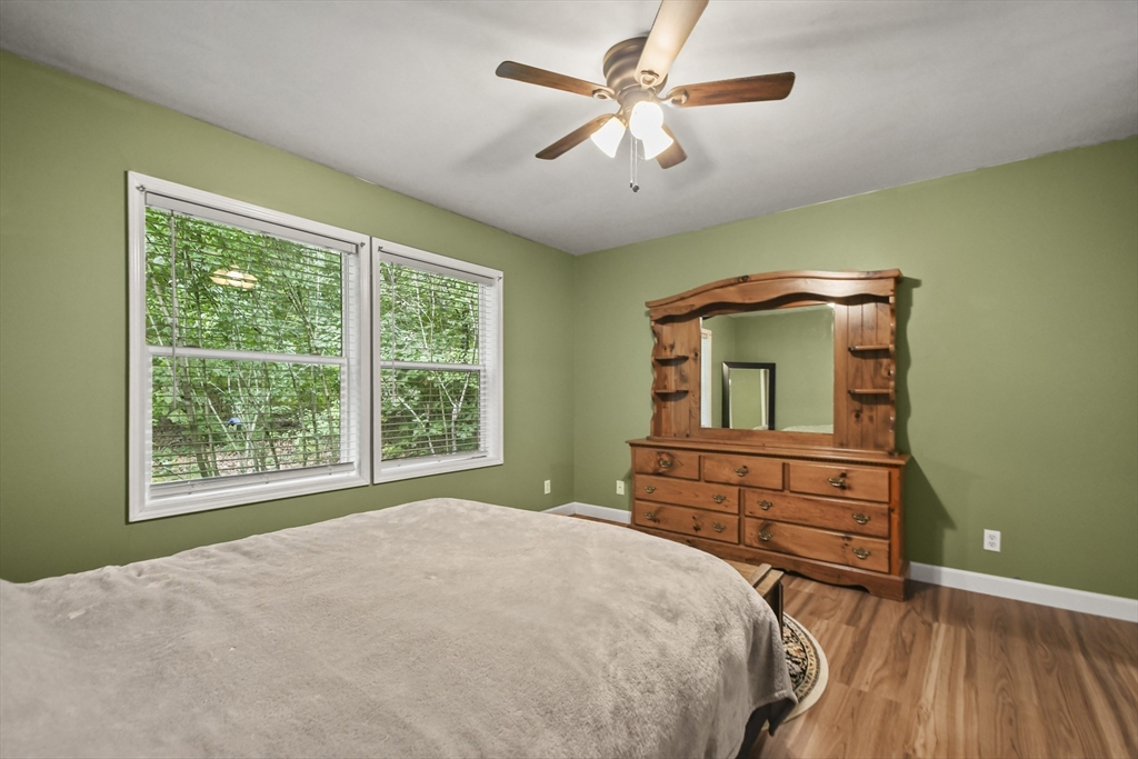 29 Prescott Street Rutland, MA 01543 - Photo 16 of 30 a bedroom with a bed and a chandelier