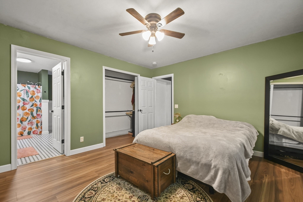 29 Prescott Street Rutland, MA 01543 - Photo 17 of 30 a bedroom with a bed and a chandelier