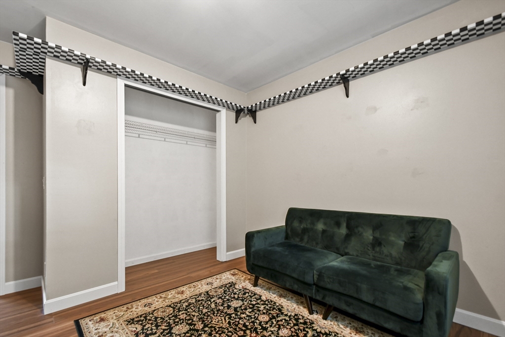 29 Prescott Street Rutland, MA 01543 - Photo 20 of 30 a living room with furniture and a rug